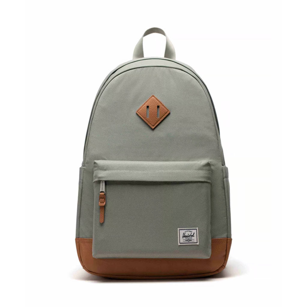 Herschel Heritage Backpack - Seagrass/White. 24L 46cm (H) x 31cm (W) x 17cm (D). EcoSystem™ 600D Fabric made from 100% recycled post-consumer water bottles. Comes with Herschel Lifetime Warranty. Shop Herschel backpacks, hip bags, tote bags and wallets online with Pavement. Free fast NZ shipping over $150.
