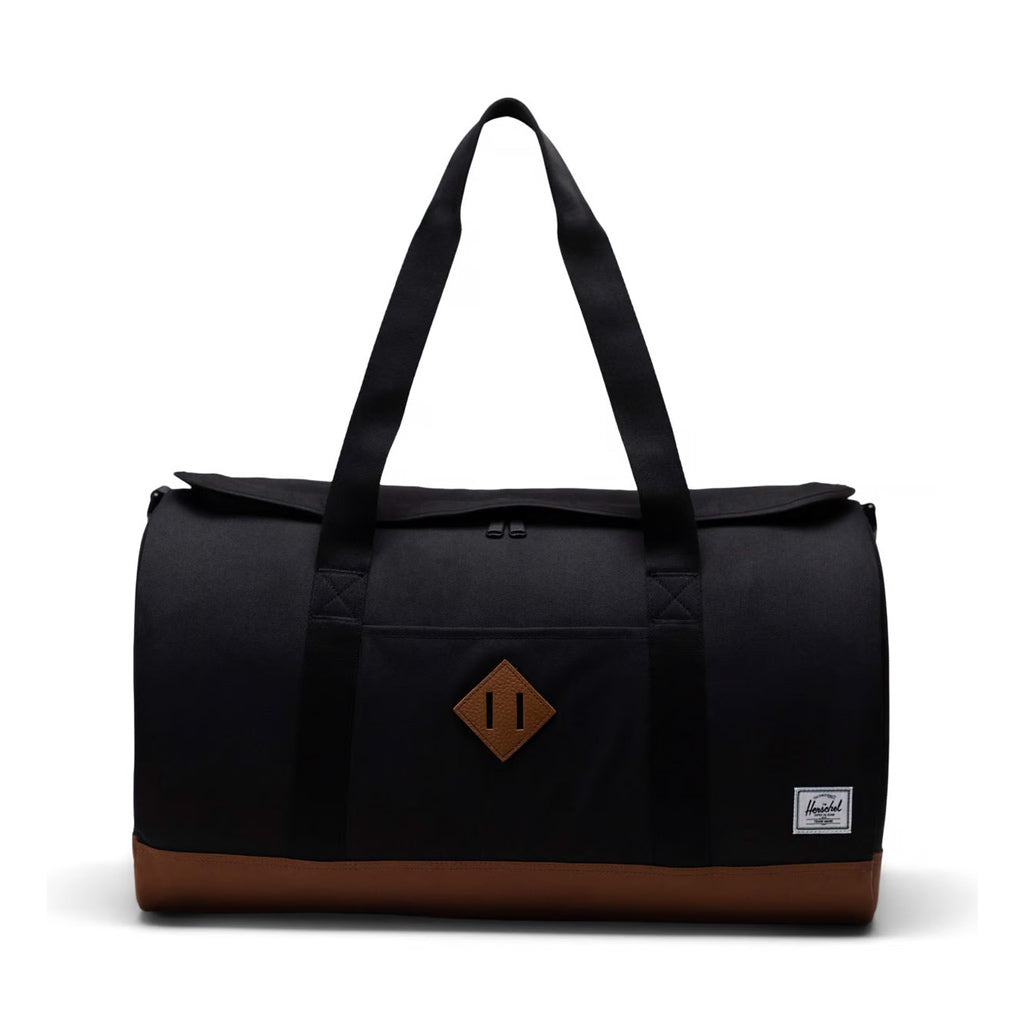 Herschel Heritage Duffle - Black/Saddle Brown. 40L 33cm (H) x 52cm (W) x 34cm (D). EcoSystem™ 600D Fabric made from 100% recycled post-consumer water bottles. Shop bags, hip packs and backpacks from Herschel online with Pavement. Free, fast NZ shipping over $150. Same day Dunedin delivery before 3pm*.