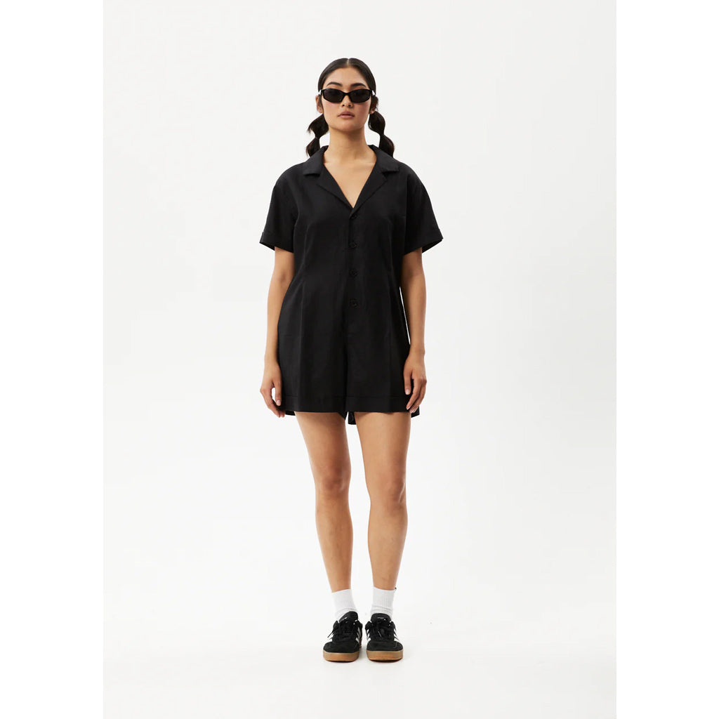 Afends Kokomo Hemp Playsuit - Black. Suit up and go on an adventure or take your new romper out for a few cheeky drinks on the town. Relaxed Boxy Fit Women's Overall. Button-Up Front. Short Capped Sleeves. V-Neckline. 55% Hemp 45% Tencel. Shop Afends women's clothing's online with Pavement, Dunedin's skate store. 