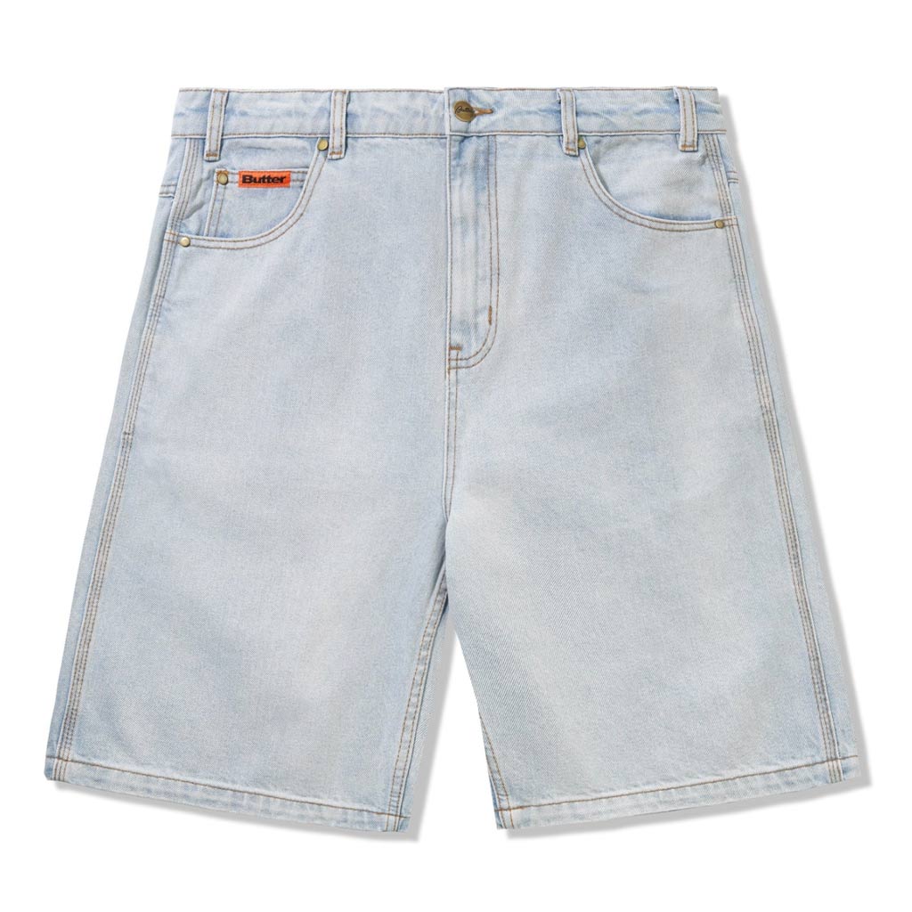 Butter Goods Baggy Denim Shorts - Light Blue. 100% Cotton baggy fit denim shorts. Contrast gold stitching. Woven label on coin pocket & back pocket. Belt loops with internal drawstring on waist band. Shop premium denim shorts from Butter Goods online with Pavement skate store -Free NZ shipping.