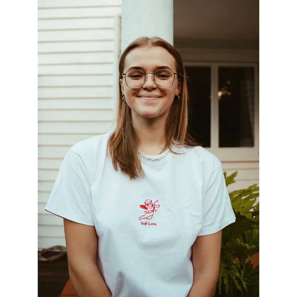Palmah Self Love Tee - White. Constructed from organic hemp + organic combed cotton. Relaxed premium 220gsm fit. Embroidered artwork at centre. Buy ethical and sustainable clothing. Shop Palmah online with Pavement and enjoy free Aotearoa shipping over $150, same day Ōtepoti delivery and easy returns.