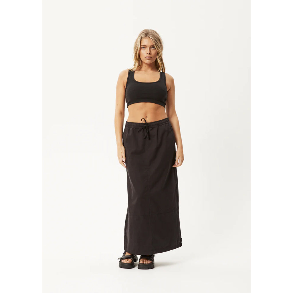 Afends Fuji Organic Maxi Skirt - Black. Paper bag waist with drawstring midi skirt. 100% Organic Cotton Twill, 7oz. Free, fast NZ shipping on your Afends order over $150. Same day delivery Dunedin before 3pm. Shop Afends online with Pavement, Ōtepoti's independent skate store.