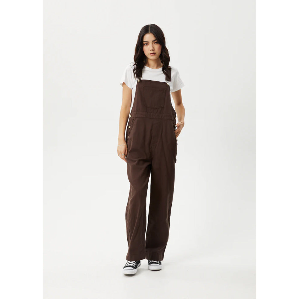 Afends Louis Oversized Overalls - Coffee. Baggy Fit. Wide Leg. 57% BCI Cotton 31% Recycled Cotton 12% Hemp. Shop Afends women's overalls with Pavement online and enjoy free, fast Aotearoa NZ shipping over $150. Same day delivery before 3 Ōtepoti Dunedin. Shop with Pavement, Ōtepoti's independent skate store since 2009.
