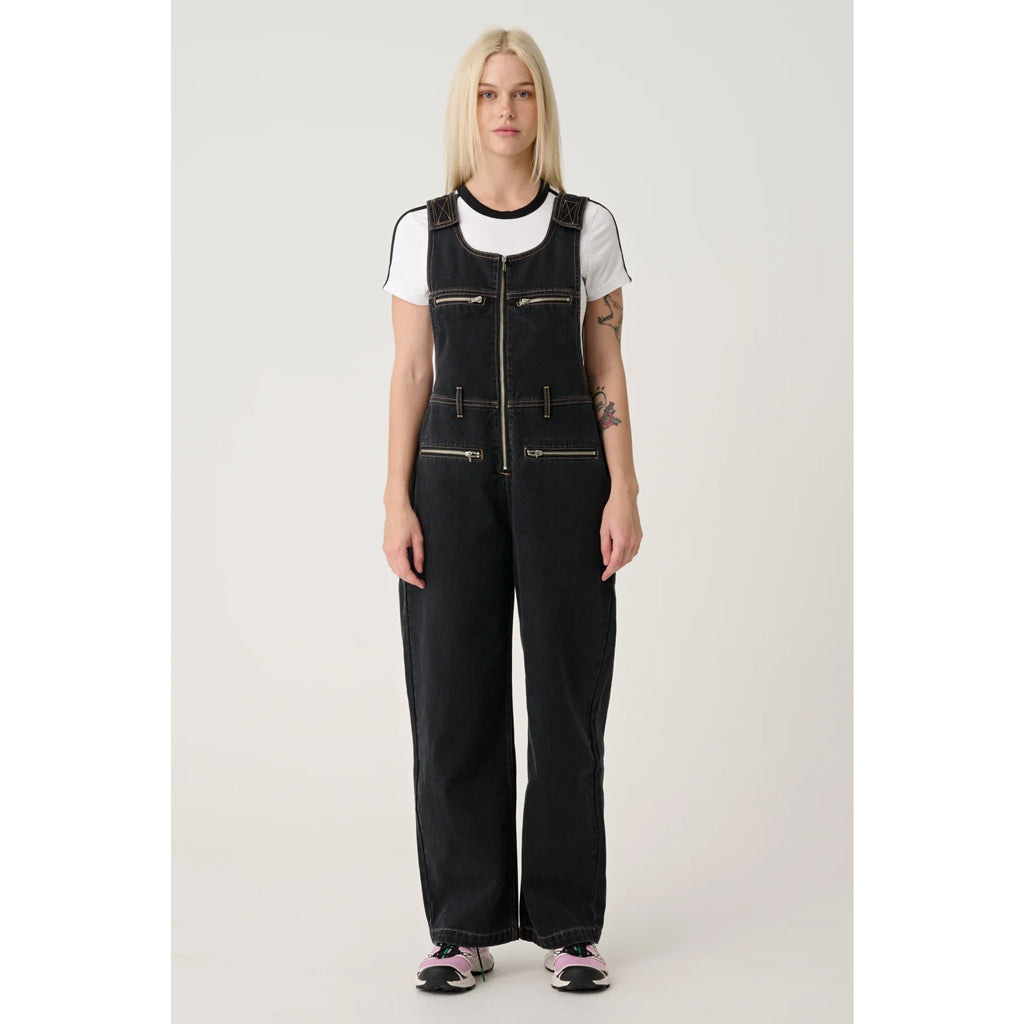 X-Girl Gordon Overall - Washed Black. X'Girl's signature heavyweight Cotton, featuring contrast colour stitching, velcro fastened straps, centre front zipper fastening, front hip pockets, front chest pockets & back patch pockets with satin stitched embroidery. Shop XGirl online with Pavement. Free NZ shipping over $150