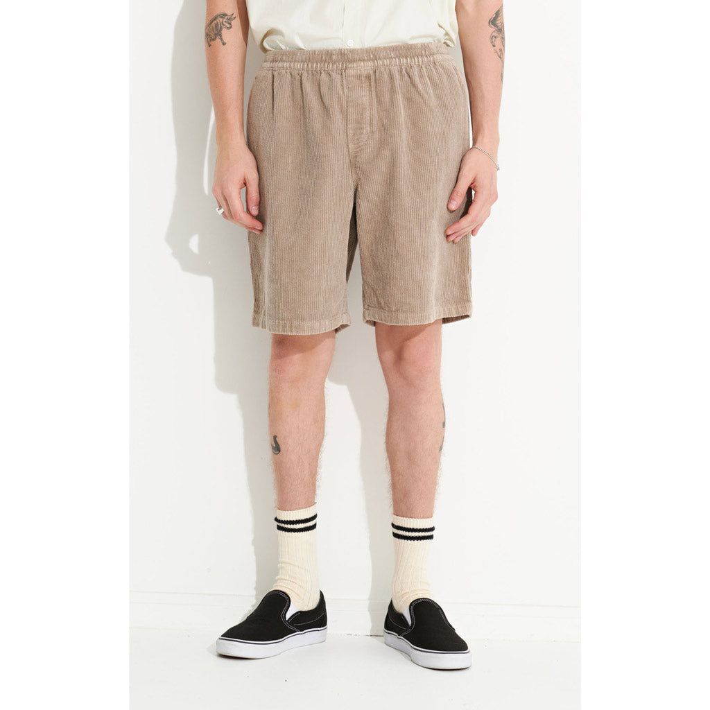 Misfit Cord Beach Metal 20" Short - Pigment Mushroom. Elasticated waist, drawcord, front in-seam pockets, back yoke, back patch pocket with woven label. Constructed from a wide wale cotton cord & finished with premium trims.