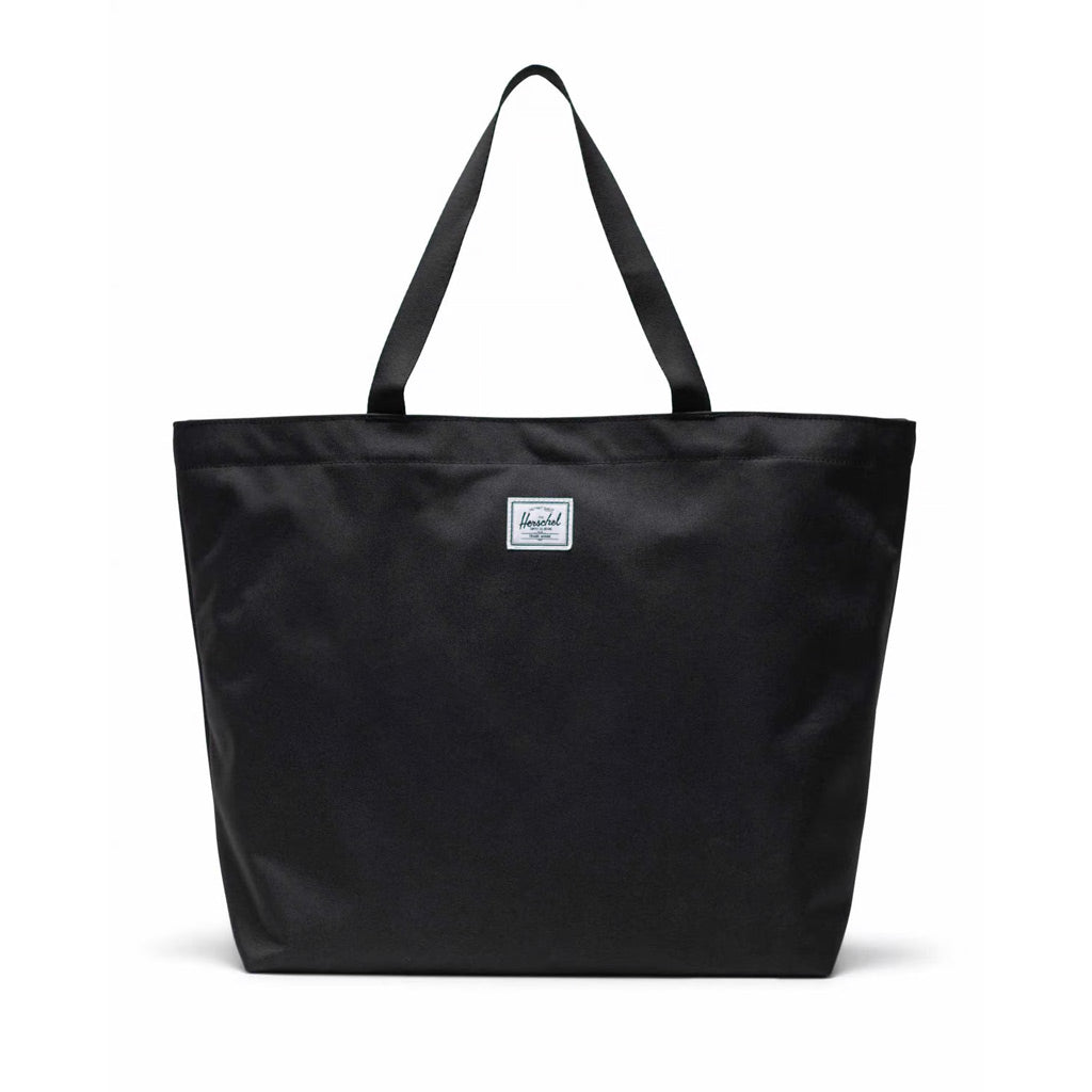 Herschel Classic Tote - Black. The one that lives on the hook at the front door. Always ready to hit the farmer's market, load up for a picnic or hit the beach. Simple design, recycled materials — this utilitarian hero is your do-it-all tote. Shop Herschel online with Pavement and enjoy free NZ shipping over $150.