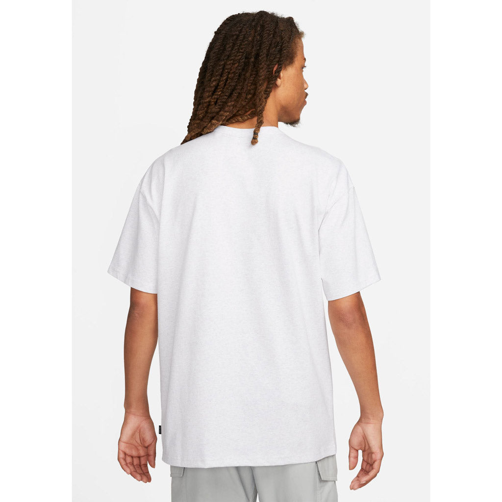 Nike Sportswear Premium Essentials Tee - Birch Heather. Loose-fitting design features dropped shoulders and room through the chest and shoulders for a relaxed look and feel. Heavyweight cotton jersey has a stiff drape and dry hand for a crisp, thick feel. DO7392-051