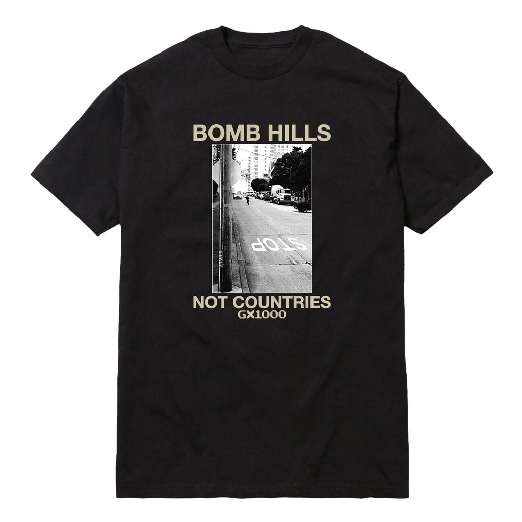GX1000 Bomb Hills Not Countries Tee - Black/Cream. Midweight Tee. 100% Cotton. Shop GX1000 skateboard decks and clothing online with Pavement skate store and enjoy free NZ shipping over $150 - Same day Dunedin delivery and easy returns. Pavement, holding down  the Dunedin skate scene since 2009.