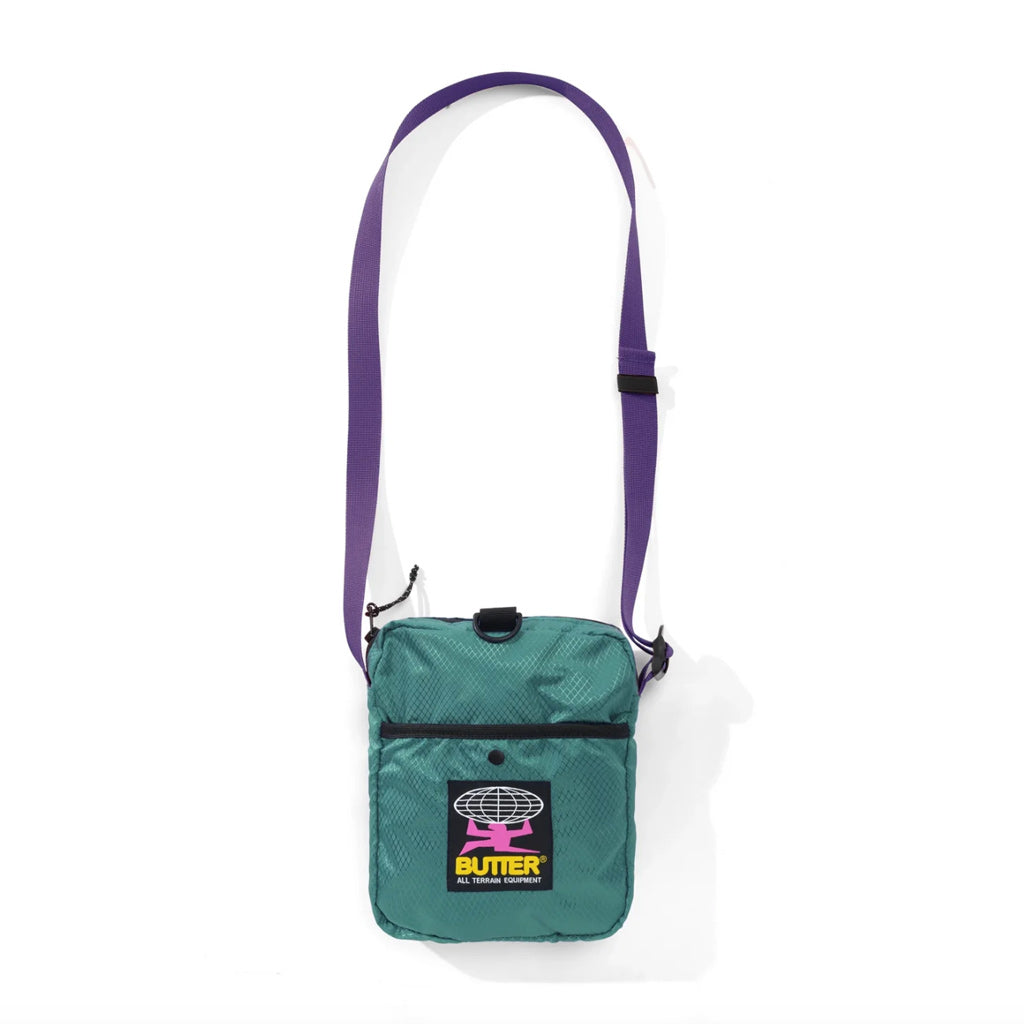 Butter Goods Ripstop Side Bag - Teal. 100% Ripstop nylon side bag. Top zip opening. Front snap pocket. Adjustable woven taping strap. Shop Butter Goods online with Pavement, Dunedin's independent skate store. Free NZ shipping over $150 - Same day Dunedin delivery, and easy returns.