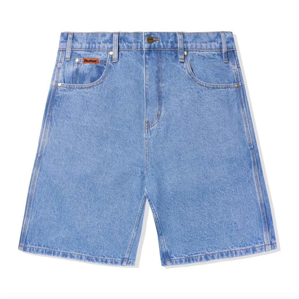 Butter Goods Baggy Denim Shorts - Washed Indigo. 100% Cotton baggy fit denim shorts. Contrast gold stitching. Woven label on coin pocket & back pocket. Belt loops with internal drawstring on waist band. Shop premium denim shorts from Butter Goods online with Pavement skate store -Free NZ shipping.