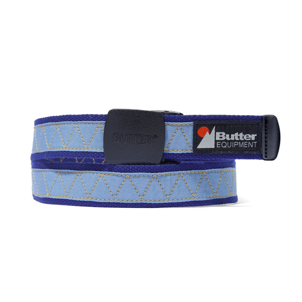 Butter Goods Equipment Woven Belt - Blue. Woven belt. Sewn on taping with zig-zag stitch detail. Plastic belt buckle & belt tip with debossed logo.  Shop Butter Goods premium streetwear clothing and accessories online with Dunedin's independent skate store, Pavement. Free New Zealand shipping over $150.