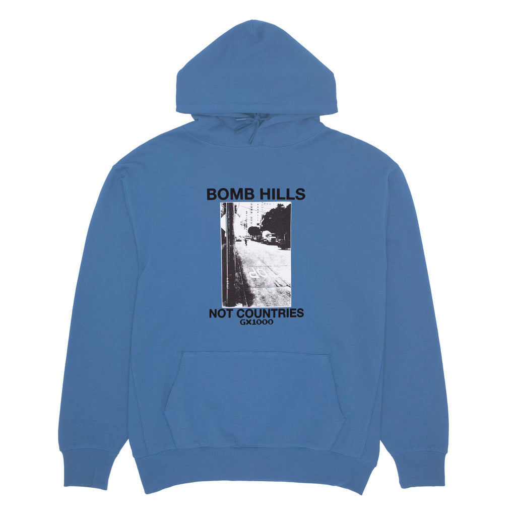 GX1000 Bomb Hills Not Countries Hoody - Columbia Blue. SK8 Fit Hoodie. 10oz Jersey Fleece. Screen Printed. 100% Cotton. Free Aotearoa NZ shipping. Shop GX1000 skateboard decks, clothing and accessories online with Ōtepoti's independent skate store, PAVEMENT.