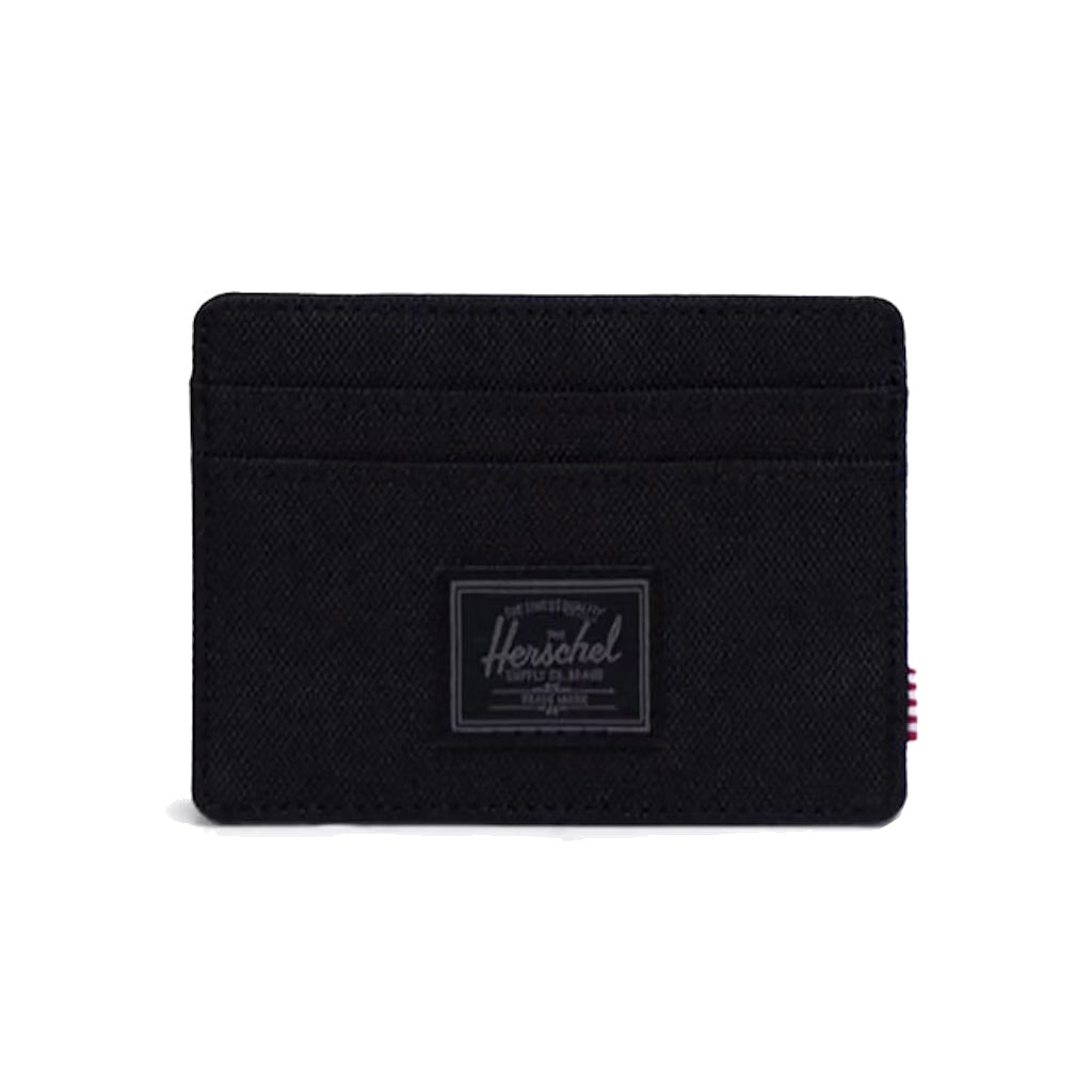 Herschel Charlie Cardholder - Black Tonal. Slim and simple. Transit pass, bank cards, ID — when that's all you need, it goes here. EcoSystem™ 600D Fabric made from 100% recycled post-consumer water bottles. Comes with Herschel Lifetime Warranty. Free NZ shipping on Herschel orders over $150. Easy returns with Pavement.