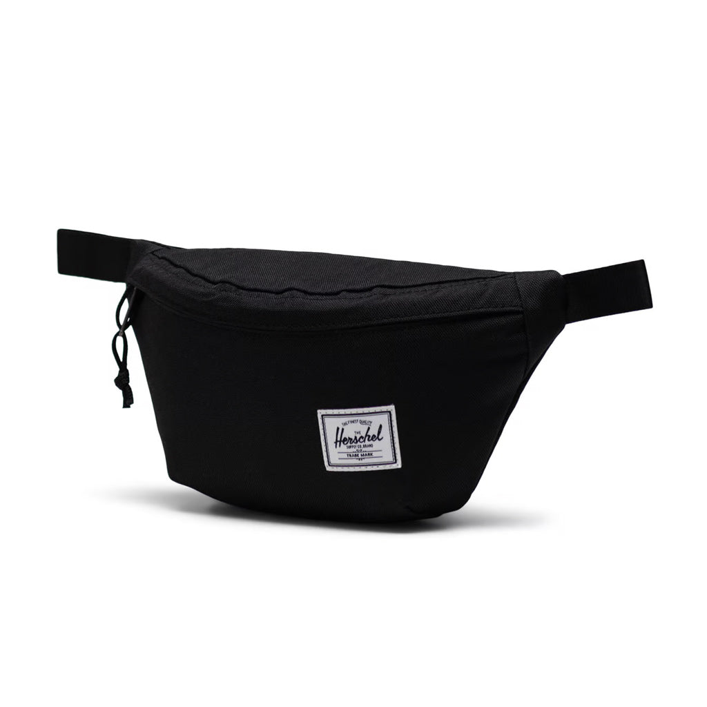 Herschel Classic Hip Pack - Black. 14cm (H) x 25cm (W) x 6cm (D) - 1L volume. EcoSystem™ 600D Fabric made from 100% recycled post-consumer water bottles. Comes with Herschel Lifetime Warranty. Shop Herschel premium bags with Pavement online and enjoy free NZ shipping over $150. Same day delivery Dunedin.