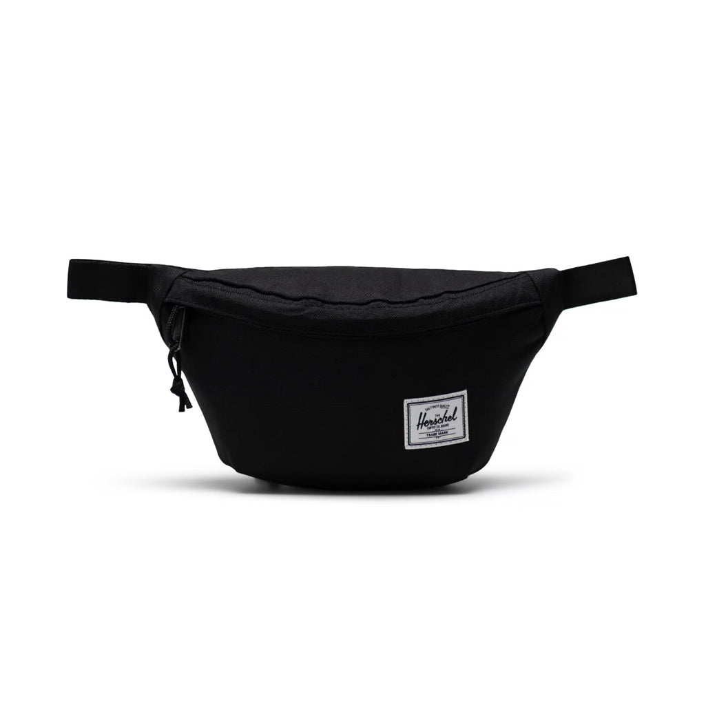 Herschel Classic Hip Pack - Black. 14cm (H) x 25cm (W) x 6cm (D) - 1L volume. EcoSystem™ 600D Fabric made from 100% recycled post-consumer water bottles. Comes with Herschel Lifetime Warranty. Shop Herschel premium bags with Pavement online and enjoy free NZ shipping over $150. Same day delivery Dunedin.