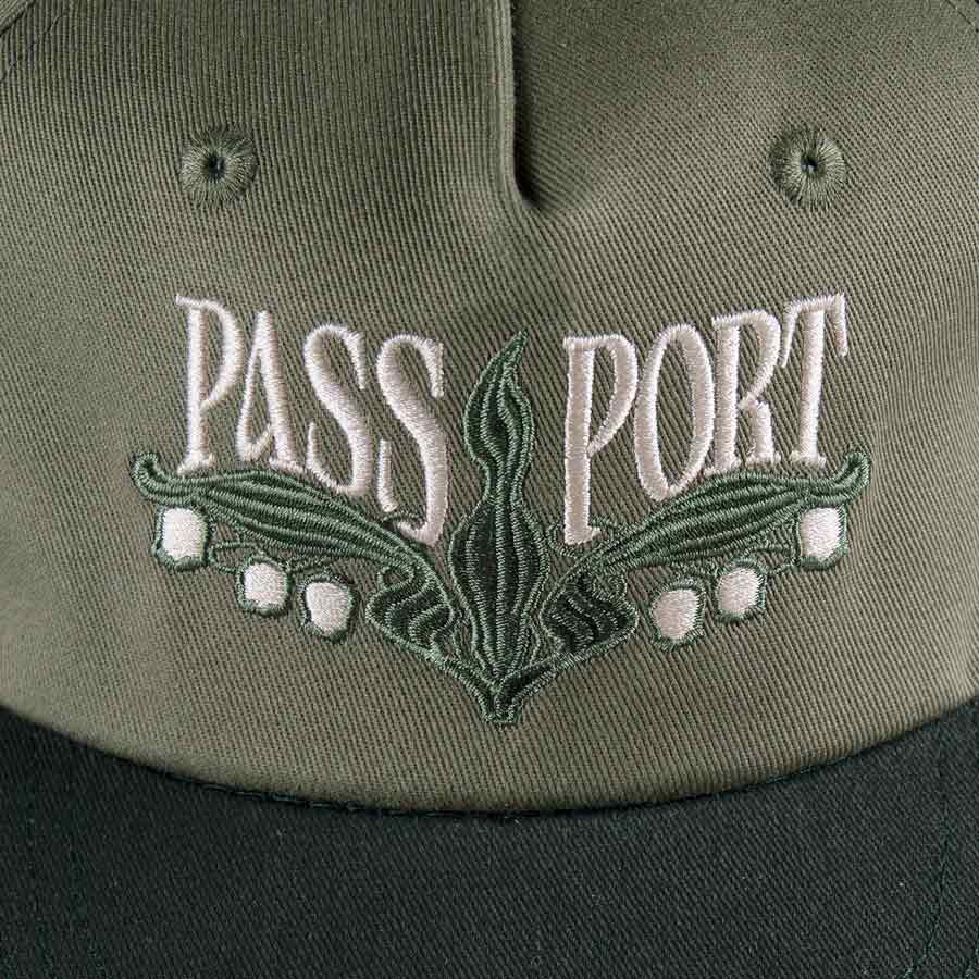 Pass~Port Lilly Of The Valley Workers Cap - Moss/Dark Military. Range #43. 5 panel construction made from 100% cotton twill and features direct embroidery with strap back adjustment. Shop Pass~Port skateboard decks, clothing and accessories online with Pavement Skate Shop NZ. Free shipping across Aotearoa over $100*.