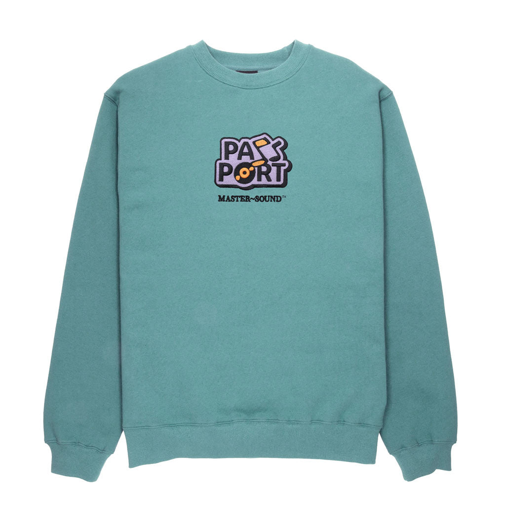 Passport Master Sound Embroidered Sweater - Washed Out Teal. Embroidery on front. Relaxed fit. Cuffed waist and sleeves. 70% Cotton / 30% Polyester. Free NZ shipping. Shop Pass~Port with Pavement skate store online.