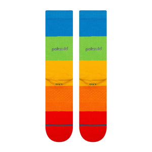 Colorful socks with a blue, green, yellow, and red pattern on a white background