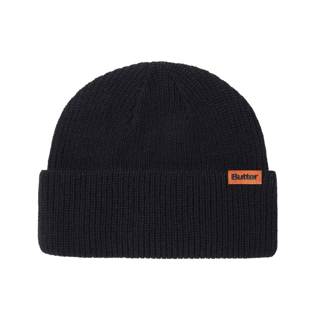 Butter Goods Tall Wharfie Beanie - Black. Loose knit acrylic fold beanie. Tall wharfie fit. Woven label on front. Size: OSFA. Shop Butter Goods online with Pavement skate store and enjoy free Aotearoa shipping over $150, same day Ōtepoti delivery and easy returns.