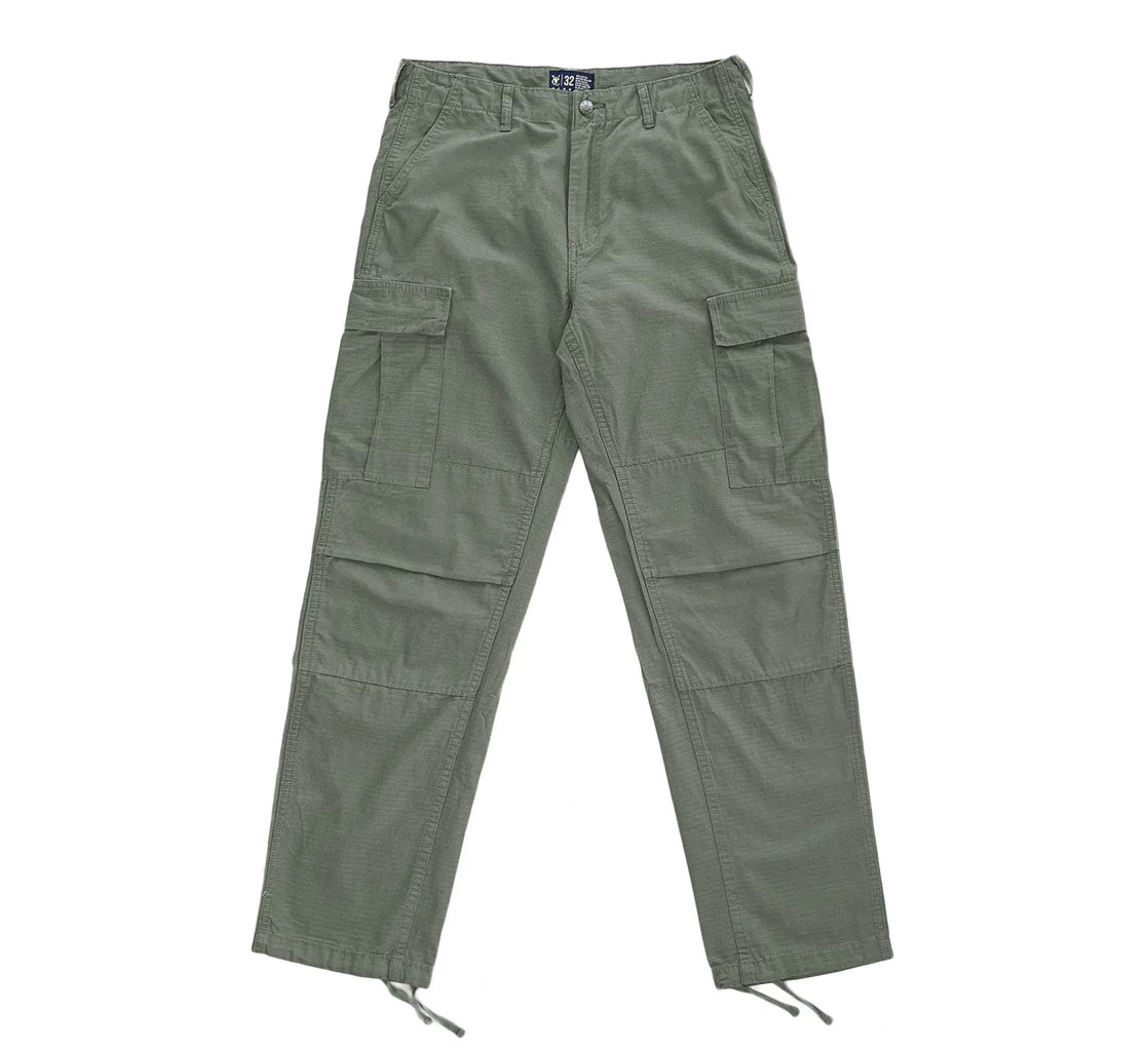 Vic Cargo Pants - Olive. Relaxed fit, low waist 100% Cotton Ripstop fabric. Double layer at knee.Slightly tapered leg. Drawstring cuffs. Shop Aotearoa's premium streetwear brand Vic online. Free, fast NZ shipping over $100. Buy now, pay later with Afterpay and Laybuy. Pavement, Ōtepoti's skate store, since 2009.