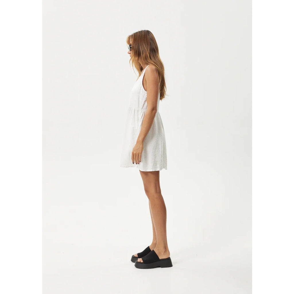 Afends Jesse Hemp Mini Dress - Natural. Relaxed-Fitting. Scooped Neckline. Scooped Back. 55% Hemp, 45% Tencel. Shop women's hemp and organic clothing online with Pavement. Free, fast NZ shipping, and easy, no fuss returns. Pavement skate store, Ōtepoti Dunedin.