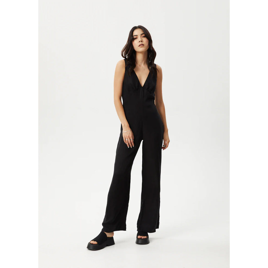 Afends Grace Cupro Jumpsuit - Black. 60% Cupro 40% Viscose, 115gsm. Shop women's Afends clothing and accessories online with Pavement and enjoy free Aotearoa NZ shipping over $150. Same day Ōtepoti Dunedin delivery before 3. No fuss returns.