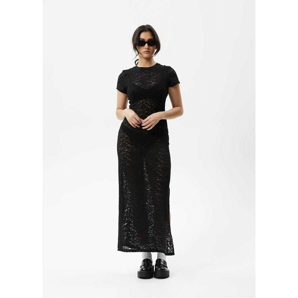 Afends Poet Lace Maxi Dress - Black. Womens Lace Maxi Dress. Stretch Lace. Sheer. T-Shirt Sleeves. Tight fitted - True to size. 90% Recycled Nylon, 10% Spandex Lace. Shop women's Afends clothing online with Pavement and enjoy free NZ shipping over $150, same day Dunedin delivery and easy returns.
