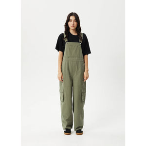 Afends Fraser Utility Overalls - Olive. Womens workwear overalls. Wide leg baggy fit. Recycled and organic cotton blend. Free New Zealand delivery - Same day Dunedin delivery. Shop Afends clothing and accessories online with Pavement, Dunedin's independent skate store, est.2009.