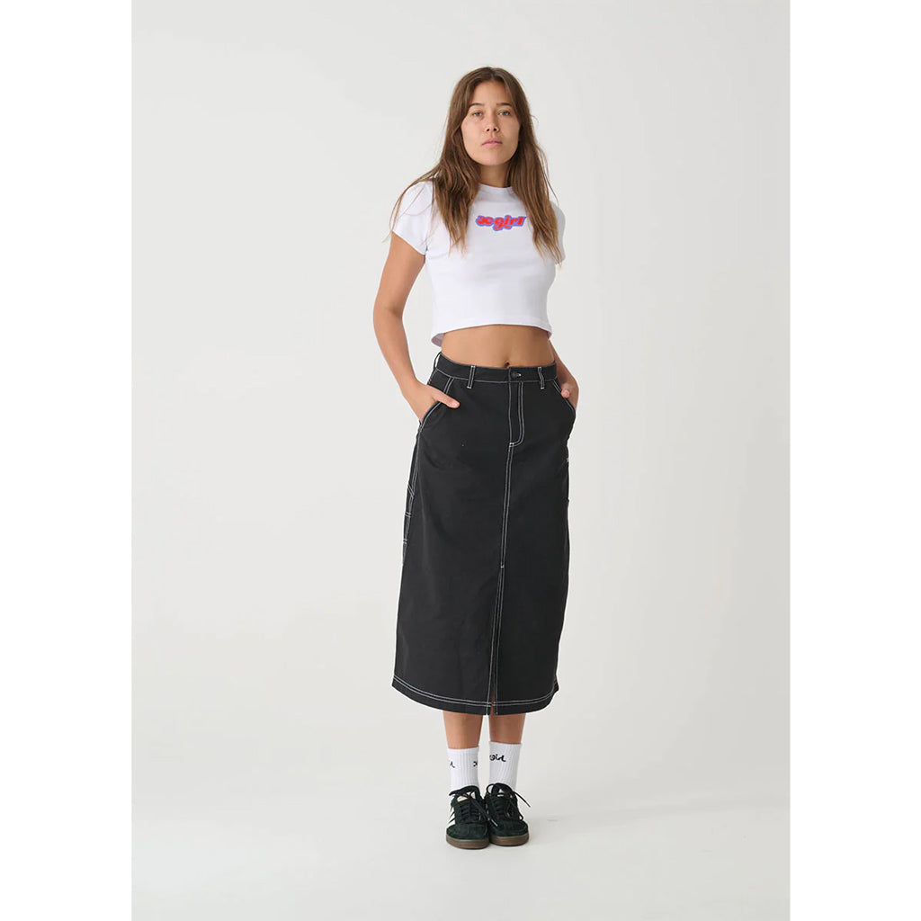 X-Girl Contrast Stitch Midi Skirt - Black. This mid rise & midi length skirt in lightweight Cotton Twill features contrast colour stitching, CB hem split, outleg tool patch pocket & signature x-girl embroidery at the front hip. Shop X-Girl clothing and accessories online with Pavement. Fast NZ shipping. 