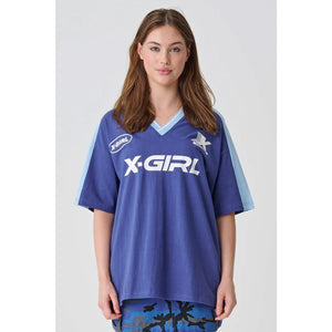 X-Girl Sporty V Neck Relaxed Tee - Navy. Oversized short sleeved V neck Tee. Front chest print. 100% Cotton Jersey. Shop X-Girl clothing online with Dunedin's independent skate store, PAVEMENT. Free NZ shipping over $150.