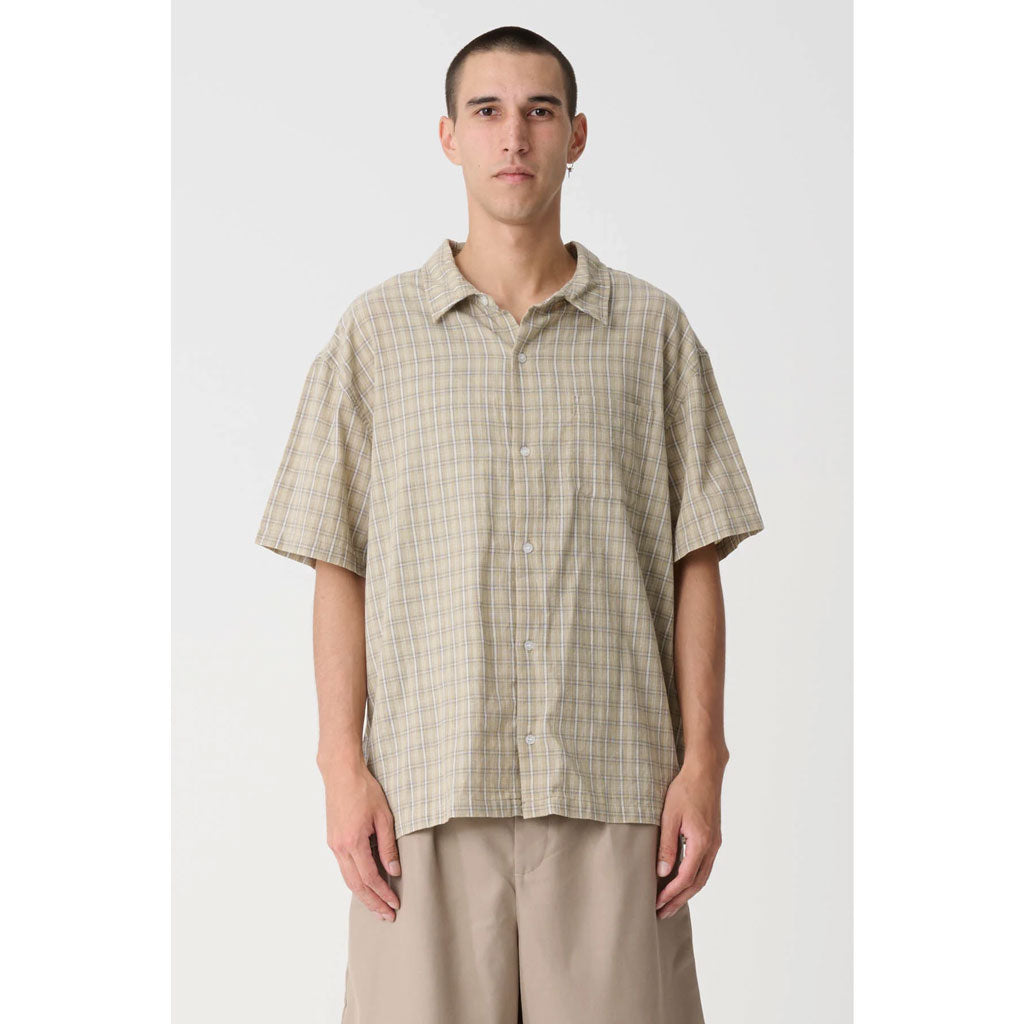 XLarge Switch Check SS Shirt - Tan. Oversized box-fit traditional short sleeve shirt. Woven label on on side seam. Button up front. Soft washed finish. Branded buttons. Straight hem. Lightweight cotton yarn dyed check. Shop Xlarge online with Dunedin's independent skate store, Pavement. Free NZ shipping over $150.