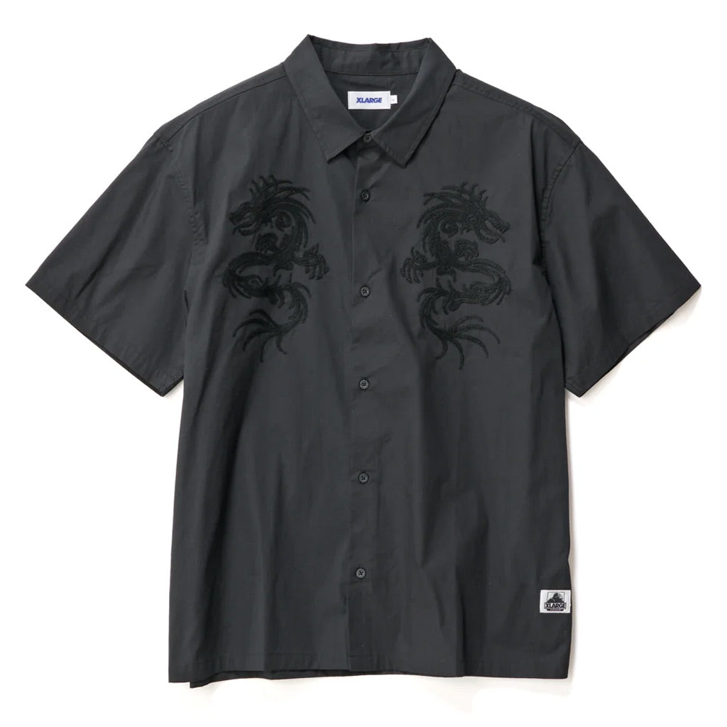 XLarge Dragon SS Shirt - Black. Oversized box-fit traditional short sleeve shirt. Chainstitch design on chest panels. Button up front. Soft washed finish. Branded buttons. Straight hem. 100% Cotton Poplin. Shop XLarge brand clothing online with Pavement and enjoy free shipping on your XLarge order over $150.