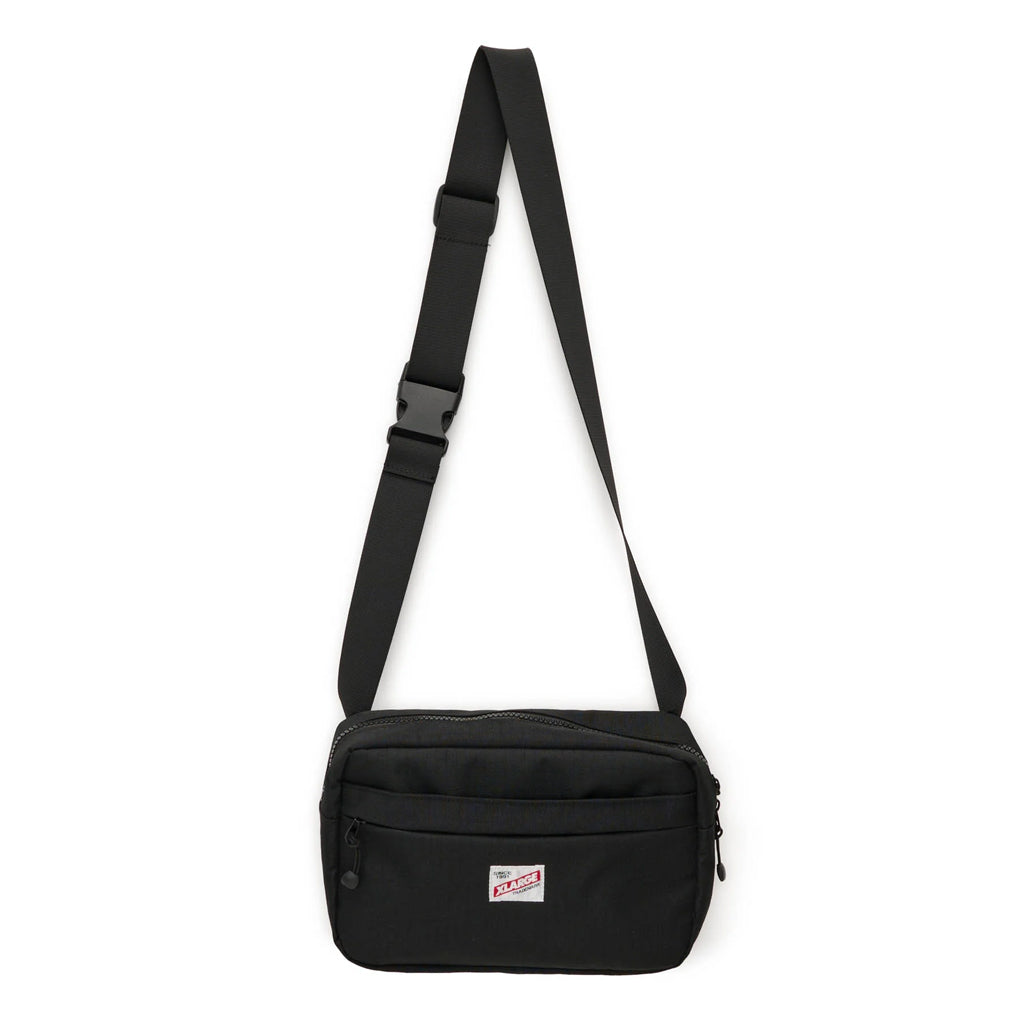 XLarge Trademark Crossbody Bag - Black. Shop XLarge and X-Girl clothing and accessories online with Dunedin's independent skate store, PAVEMENT. Free shipping across Aotearoa NZ on orders over $150 | Same day Ōtepoti/Dunedin delivery | Easy returns.