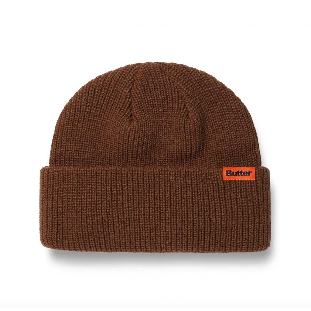 Butter Goods Tall Wharfie Beanie - Oak. Loose knit acrylic fold beanie. Tall wharfie cut. Woven label on front. Size: OSFA. Shop Butter Goods online with Pavement skate store, Dunedin's independent since 2009. Free NZ shipping over $150 - Same day Dunedin delivery - Easy returns.