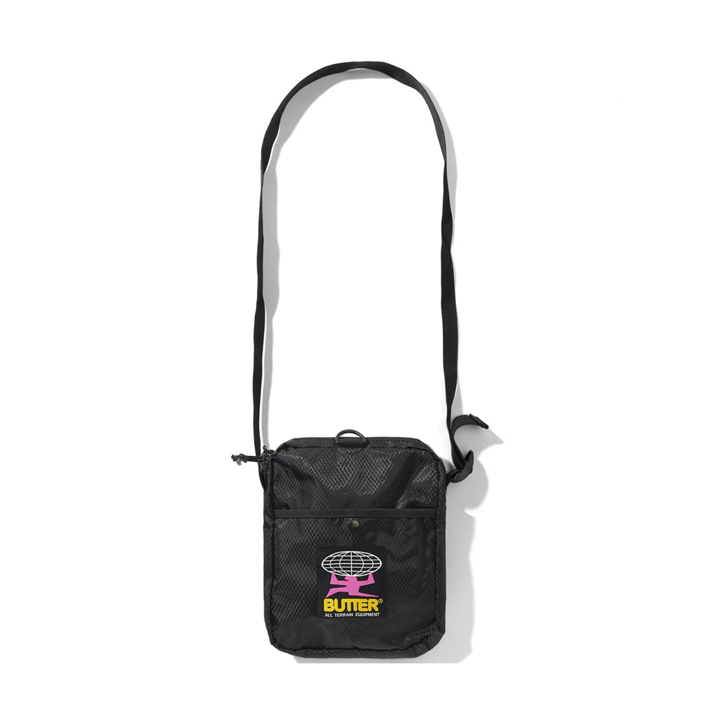 Butter Goods Ripstop Side Bag - Black. 100% Ripstop nylon side bag. Top zip opening. Front snap pocket. Adjustable woven taping strap. Width 22.5cm / 8.8". Length 18cm / 7". Shop Butter Goods online with Pavement skate store. Free NZ shipping over $150. Easy returns.