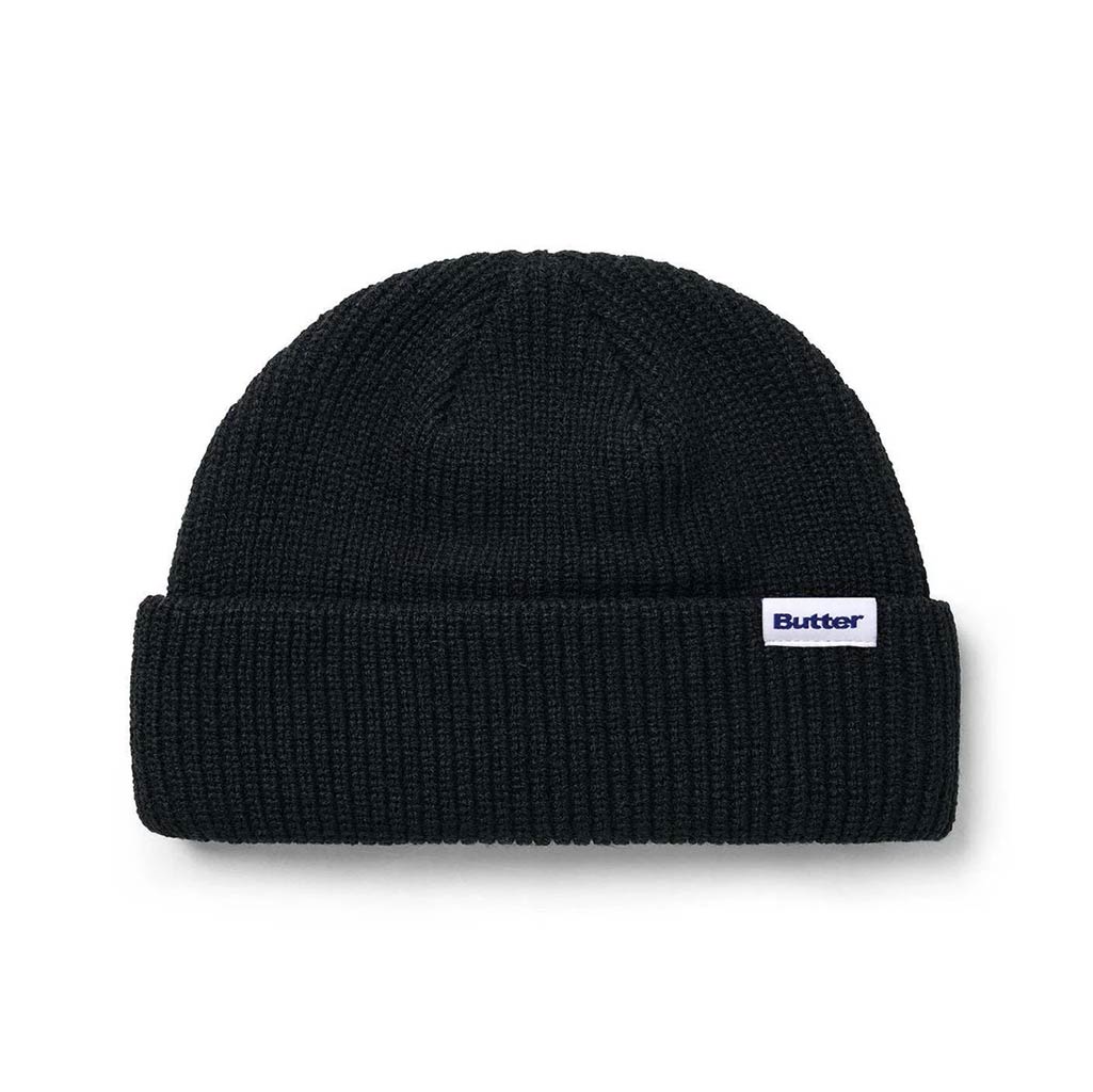 Butter Goods Wharfie Beanie - Black. Loose knit acrylic fold beanie. Low Profile wharfie fit. Woven label on front. Shop Butter Goods online with Pavement skate store, and enjoy free Aotearoa shipping over $150, same day Ōtepoti delivery and easy returns.