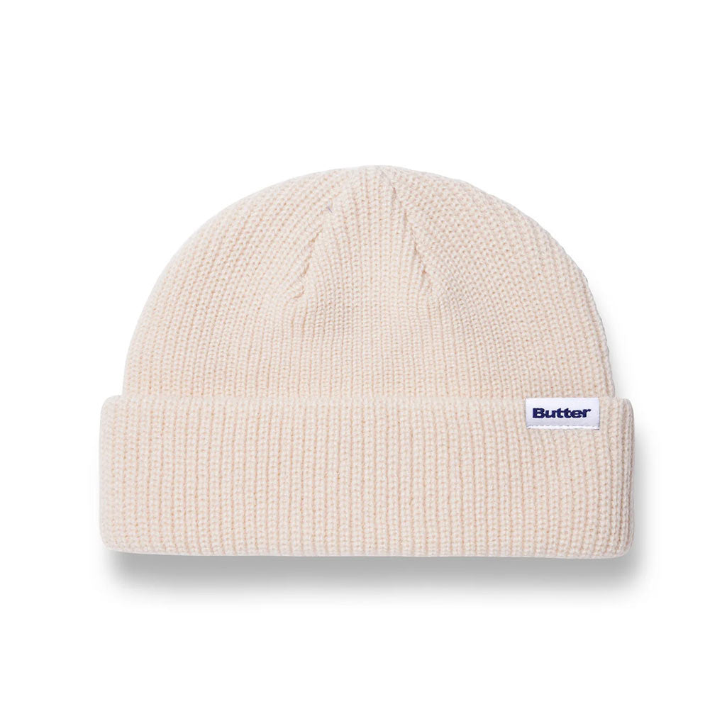 Butter Goods Wharfie Beanie - Bone. Loose knit acrylic fold beanie. Low Profile wharfie fit. Woven label on front. Shop Butter Goods online with Pavement skate store, and enjoy free Aotearoa shipping over $150, same day Ōtepoti delivery and easy returns.