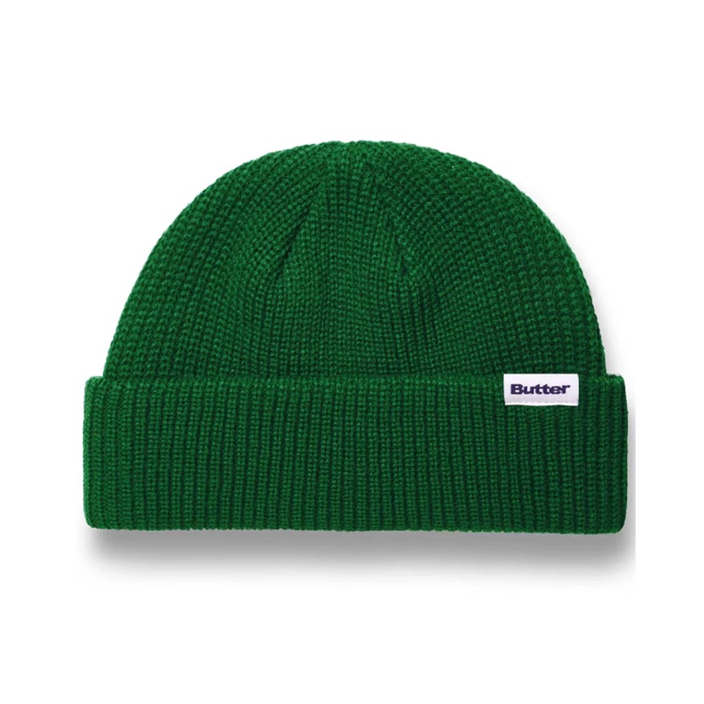 Butter Goods Wharfie Beanie - Forest. Loose knit acrylic fold beanie. Low Profile wharfie fit. Woven label on front. Shop Butter Goods online with Pavement skate store, and enjoy free Aotearoa shipping over $150, same day Ōtepoti delivery and easy returns.