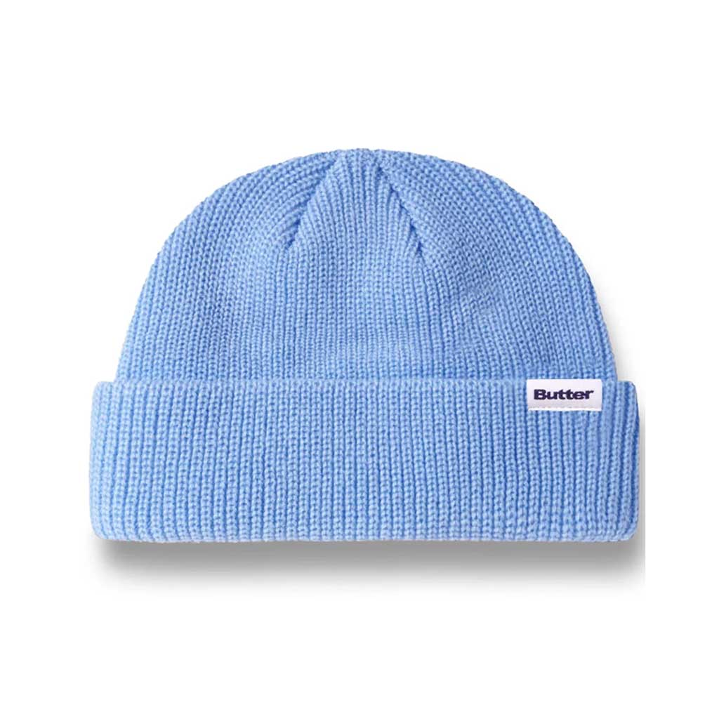 Butter Goods Wharfie Beanie - Pacific Blue. Loose knit acrylic fold beanie. Low Profile wharfie fit. Woven label on front. Shop Butter Goods online with Pavement skate store, and enjoy free Aotearoa shipping over $150, same day Ōtepoti delivery and easy returns.