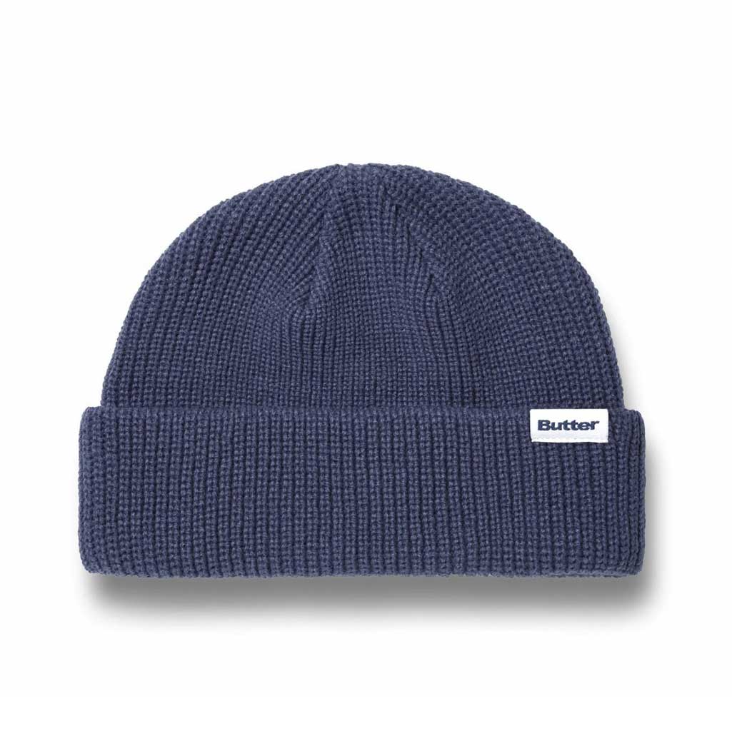 Butter Goods Wharfie Beanie - Slate. Loose knit acrylic fold beanie. Low Profile wharfie fit. Woven label on front. Shop Butter Goods online with Pavement skate store, and enjoy free Aotearoa shipping over $150, same day Ōtepoti delivery and easy returns.