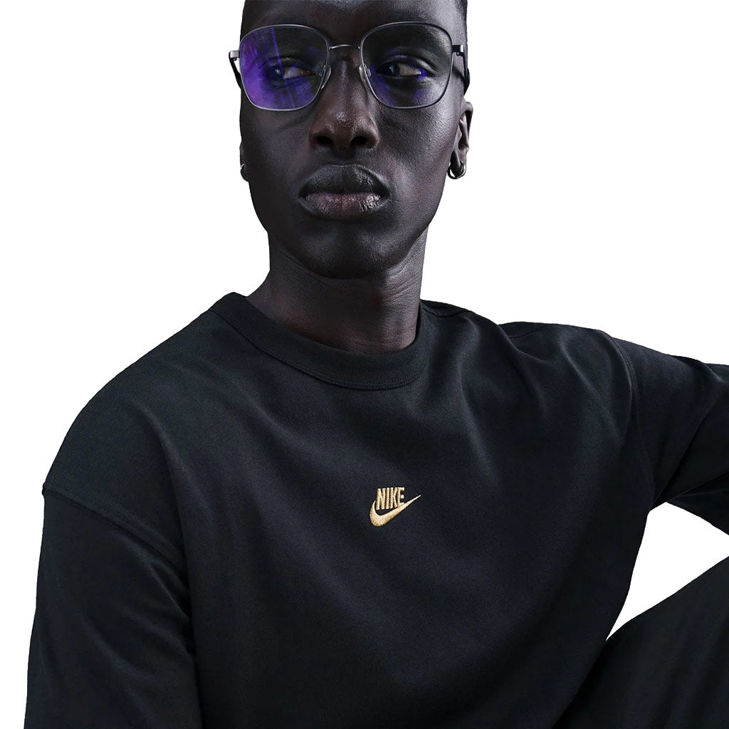 Nike Sportswear Premium Essential Tee in Black/Gold | Free Aotearoa NZ shipping on your Nike SB order over $100* when you shop with Pavement Skate Store!
