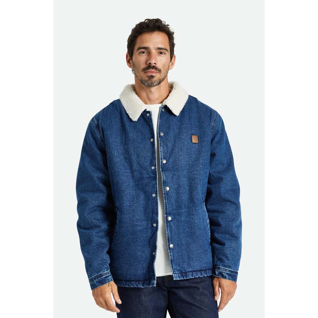 Brixton Beta Lined Coaches Jacket - Worn Indigo. 100% cotton Sherpa lined. Weather repellant. Elastic cuffs and hem. Left pocket faux leather patch. Shop Brixton men's jackets and shirts and enjoy free NZ shipping on orders over $100. Pavement skate shop, Dunedin.