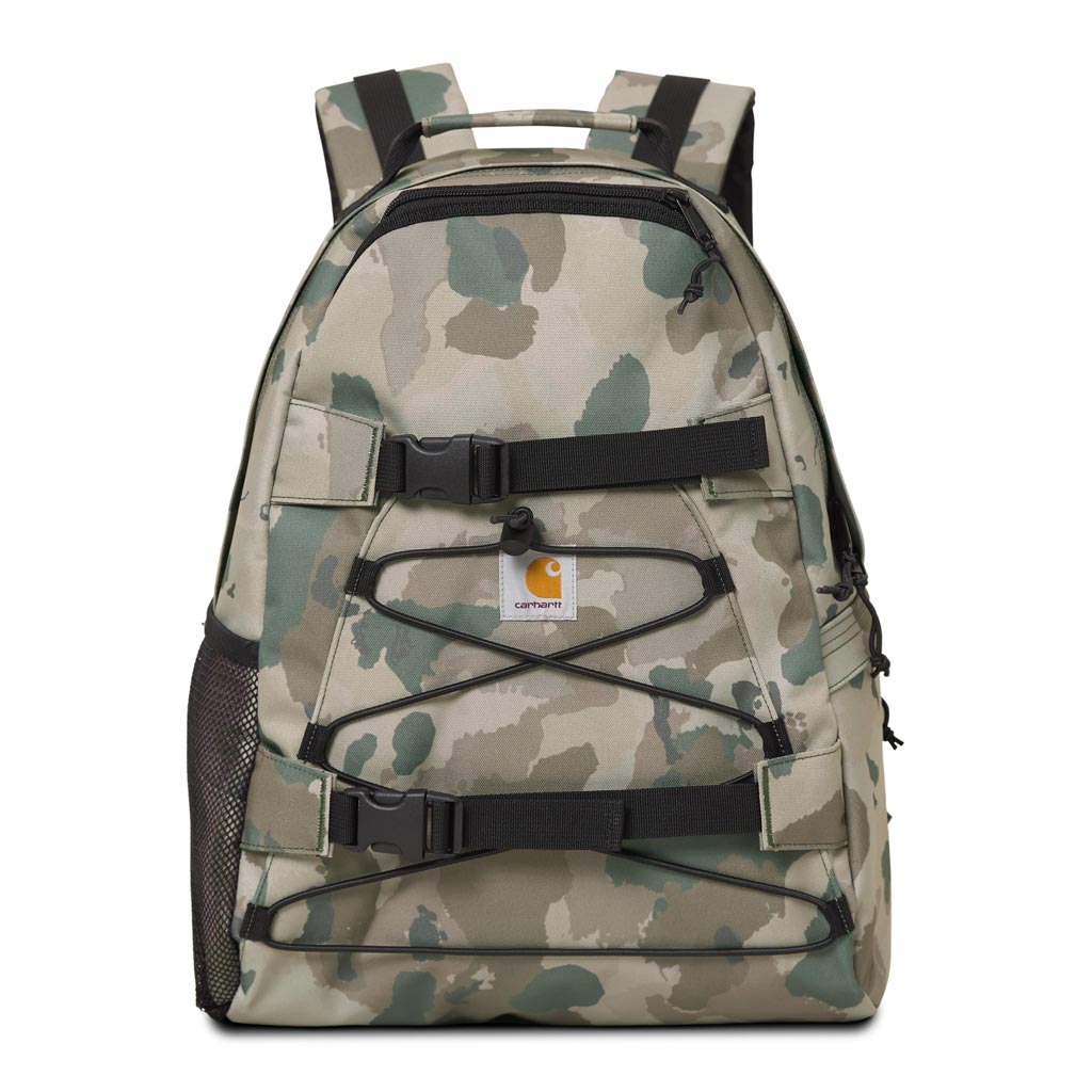 Carhartt WIP Kickflip Backpack - Camo Tide/Thyme. 100% Polyester Duck Canvas, 11 oz 45 x 29 x 19 cm. 16 litre water repellent fabric. Unlined. Two-way zip closure. Side pocket with zip closure. Mesh side pocket. Board fixation with plastic clickers. Square label.
