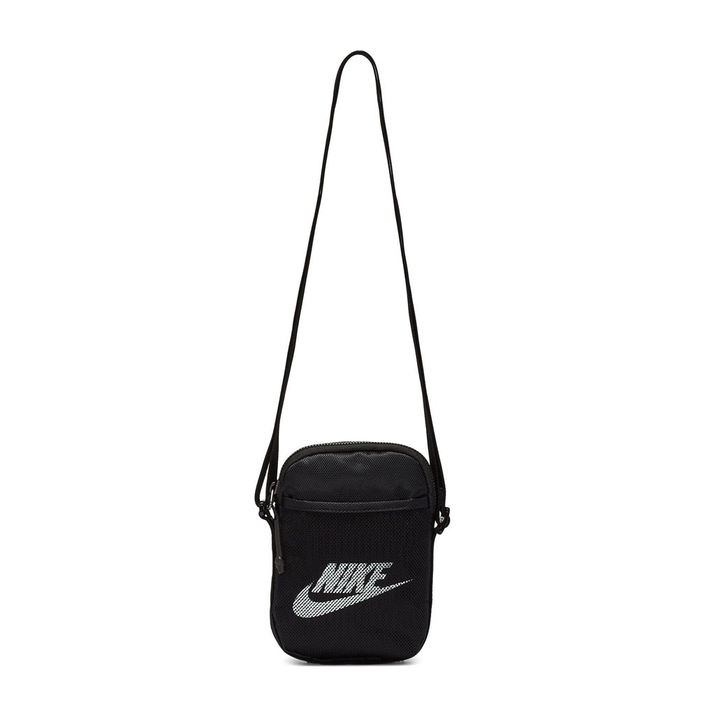 Nike Heritage S Crossbody Bag. The Nike Heritage Crossbody Bag Gives You A Durable Design With Multiple Compartments To Help Keep You Organised. Adjustable Cross-Body Strap For Versatile Carrying Options. 18Cm H X 13Cm W X 3Cm D -1L. Fabric: Body: 80% Nylon/20% Polyester. Lining: 100% Polyester. BA5871-010. Pavement