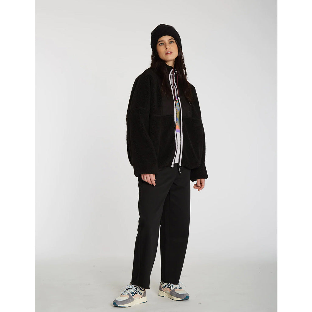 Volcom Fuzoff Zip - Black. Women's full zip sherpa micro polar fleece Jacket - Loose fit. Weight : 430g. Mockneck with adjustable drawcord. Enjoy free NZ shipping on your Volcom women's clothing orders over $100 with Pavement, Dunedin's independent skate store.